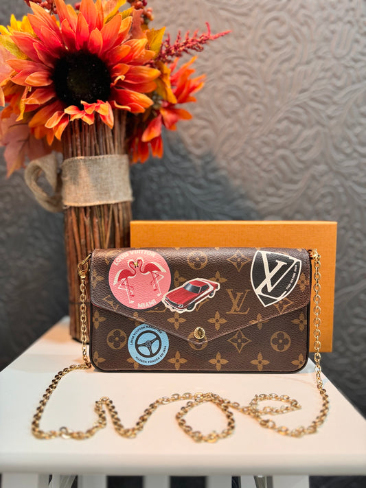 LOUIS VUITTON LIMITED EDITION WORLD TOUR FELICIE POCHETTE IN MONOGRAM CANVAS.